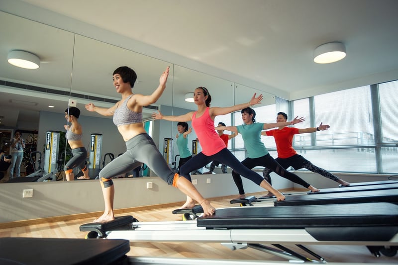 Woman doing Reformer Pilates